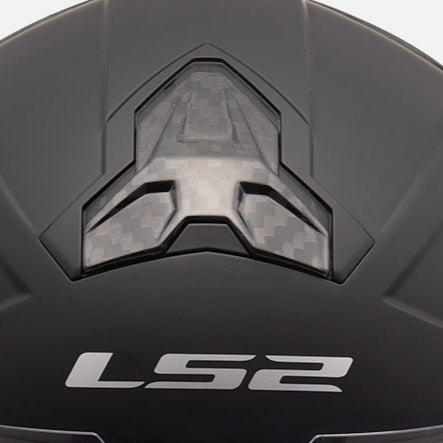 Close-up of a black helmet with 'LS2' branding on a white background
